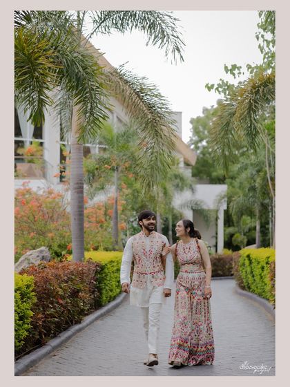 A casual stroll through the beautiful pathways of a resort in Udaipur. A perfect, relaxed couple portrait.