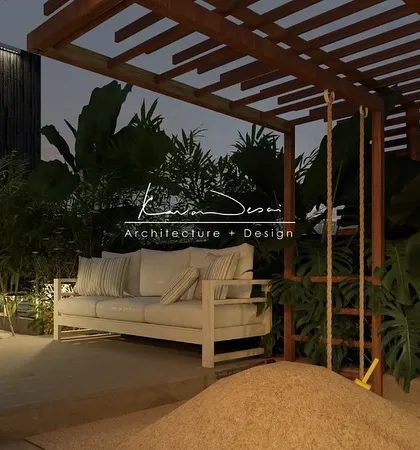 A cozy corner of a terrace at night. The wooden pergola, comfortable sofa, and a playful swing create a relaxed, bohemian vibe, proving that outdoor spaces can be just as intimate as interiors.
