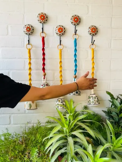 A beautiful set of five macrame ceramic bells in different colors. These are one of our best-selling products, and you can customize the colors to create your own unique set.