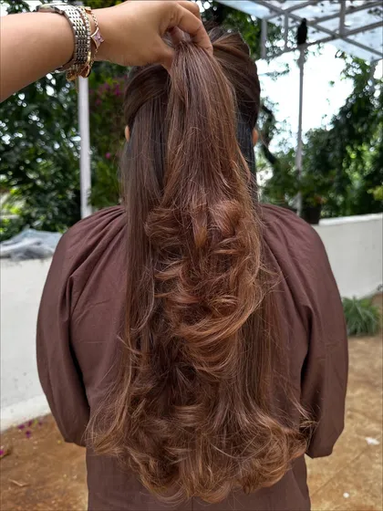 A beautiful color refresh for this client, getting her vacay-ready. I added soft, natural-looking highlights to her long hair and finished with a layered cut and bouncy curls for a glamorous feel.