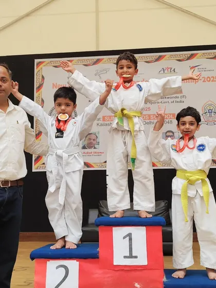 The joy of achievement is a powerful motivator. Here, our young students celebrate their victories at the New Delhi District Taekwondo Championship. We don't just teach techniques; we build the confidence to compete and the resilience to win.