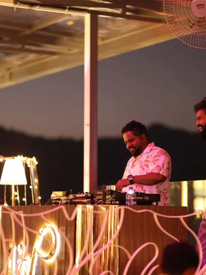 A candid shot of me enjoying the moment during a rooftop party. The warm lighting and relaxed atmosphere show a different side of my DJ services, perfect for more intimate gatherings.
