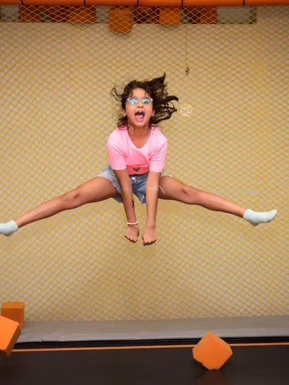 Jump for joy on our indoor trampoline! It's the perfect spot for kids to burn off energy, practice their moves, and fly high in a completely safe, netted environment.