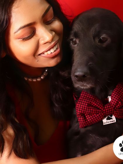 A close-up of my dog wearing the red check bow. It's the perfect accessory for a special occasion or just to show some extra love.