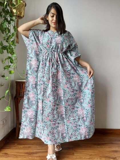 A soft blue kaftan with a lovely pink and green floral hand-block print. This piece combines comfort with a touch of feminine charm.