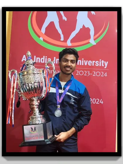 One of our players proudly holding the team's trophy after a hard-fought tournament.