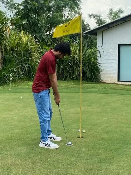 Practice makes perfect! Jitendra Kumar works on his putting stroke, aiming for the hole. We enjoyed sharing our passion for golf with him.