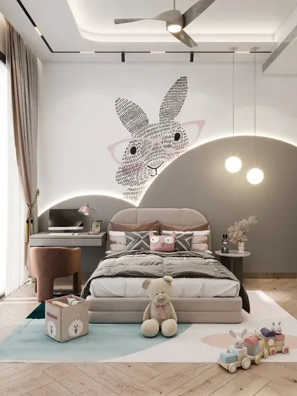 We designed this whimsical room for a three-year-old, using soft pastel colors and storybook-inspired shapes. The space includes a custom headboard with integrated lighting, a playful rabbit wall graphic, and a dedicated study nook, balancing imaginative design with practical functionality.