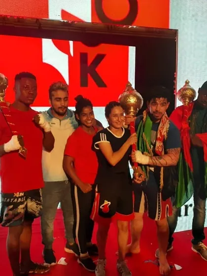 Our champions, including Justin Kennedy and Zeba Bano, celebrating their victories at a Knight Pro MMA event.