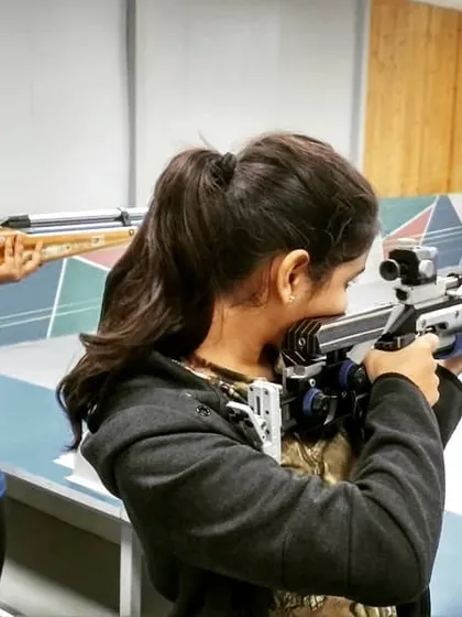 A closer look at our students during rifle practice, showing their focus and the proper handling of the equipment.