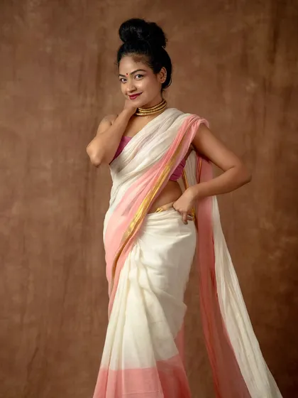 A playful and elegant pose from my photoshoot, showing the versatility of a simple cotton saree.
