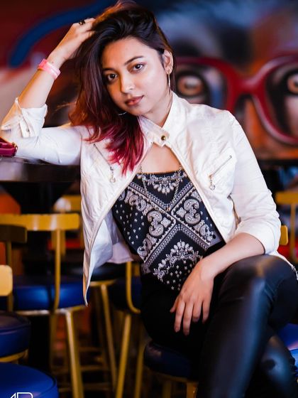 A guest posing at the bar.