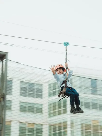 Adventure is calling! I love setting up thrilling activities like this zip line at community fiestas. It’s a safe and super exciting experience that gives kids a rush and parents a great photo opportunity.