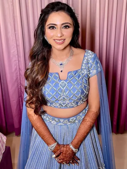 The bride looking happy and confident with her sangeet look.