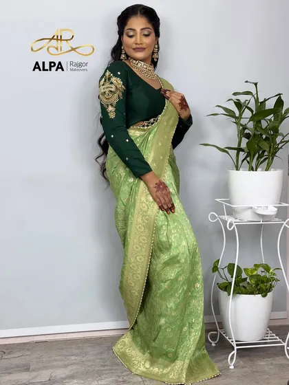 Another full-length shot of the elegant green saree look.