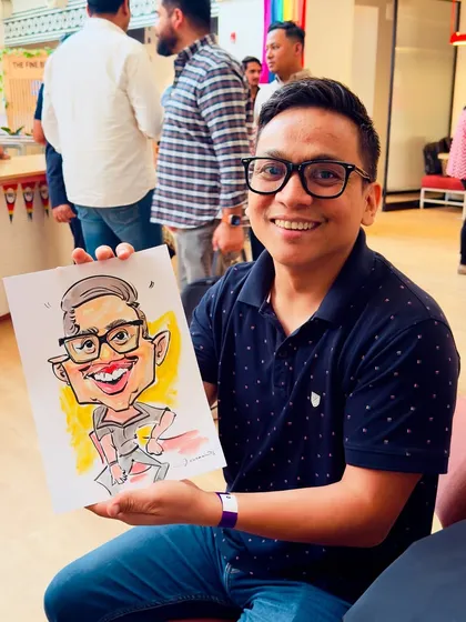 A guest at a WeWork event with his colorful and expressive caricature. These sessions are all about where work meets fun, and faces come to life.