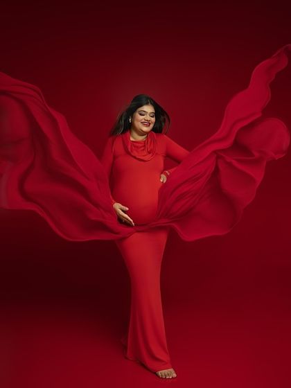 The magic of flowing fabric. I use drapes and movement to add a sense of life and energy to my portraits, turning a simple pose into a dynamic work of art. This shot in a vibrant red gown captures that feeling perfectly.