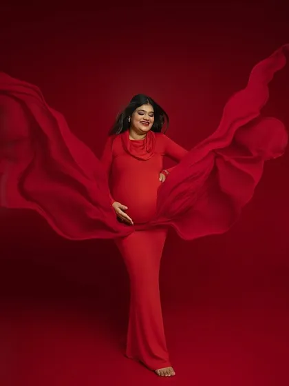 The magic of flowing fabric. I use drapes and movement to add a sense of life and energy to my portraits, turning a simple pose into a dynamic work of art. This shot in a vibrant red gown captures that feeling perfectly.