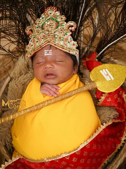 A final shot of the newborn Murugan, capturing the full divine setup. These photos become cherished family heirlooms.