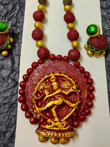 My Nataraja necklace set, celebrating the cosmic dance of Lord Shiva. The central pendant is surrounded by textured beads, and the set includes matching jhumkas. It's a powerful piece for Mahashivratri or for any devotee.