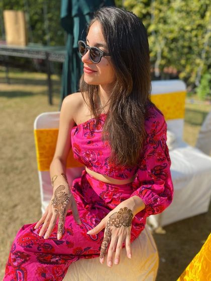 Another view of the client's modern mehndi, showing how it complements her stylish look.