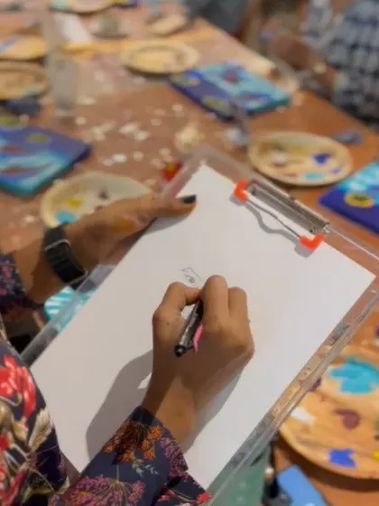 A close up of me in action at a Third Wave Coffee event. I love chatting with people while I draw.