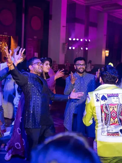 Guests dancing with abandon at a sangeet after-party. Our DJs and live bands know exactly how to keep the party going all night long.