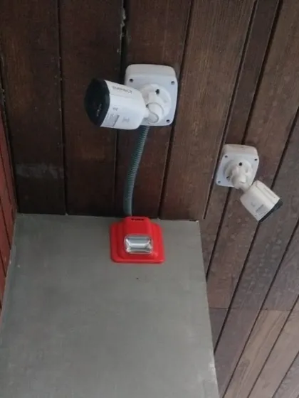 This installation shows how we can integrate fire alarm systems with other security measures. Here, a manual fire alarm call point with a strobe light is installed alongside CCTV cameras for comprehensive property security.