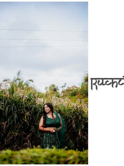 A wide shot of the bride standing in a field of tall grass, creating a beautiful contrast between her and nature.