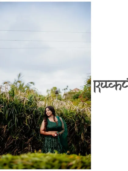 A wide shot of the bride standing in a field of tall grass, creating a beautiful contrast between her and nature.