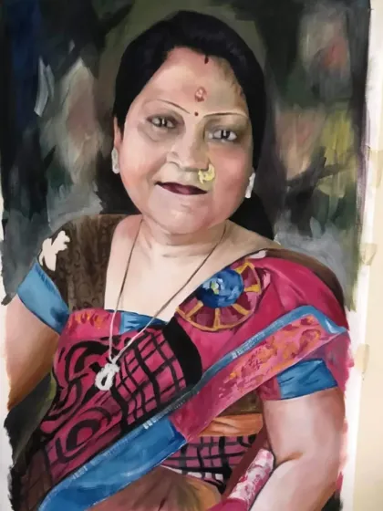 An oil portrait capturing the personality of the subject, with attention to her traditional jewelry and colorful saree.
