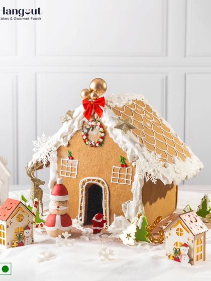 This grand Gingerbread House is a magical centerpiece for the holidays. Intricately decorated, it's crafted to create sweet memories and add a touch of wonder to your festive decor.