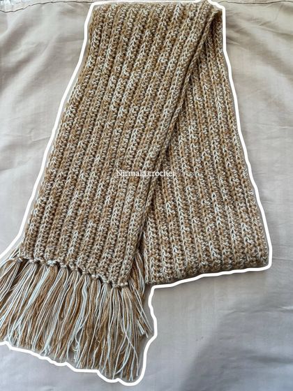 A full view of the chunky, two-meter-long muffler, ready to be shipped to a new home.