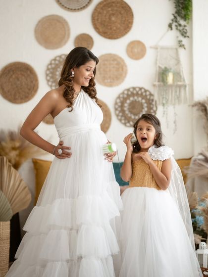 A priceless moment of surprise and joy as a big-sister-to-be listens to her mommy's belly.