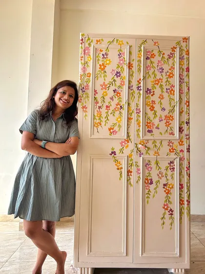 Standing proudly next to the finished floral almirah. This project shows how even a heavy, old metal piece can become a work of art that preserves memories.