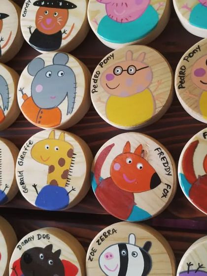 A close-up of the Peppa Pig memory game, featuring characters like Pedro Pony, Freddy Fox, and Gerald Giraffe, all painted with love.