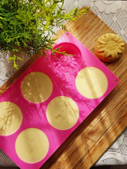A freshly unmolded Pumpkin Cream salt bar next to its mold. These bars are made with sea salt, which makes them incredibly hard, so they need to be unmolded quickly.