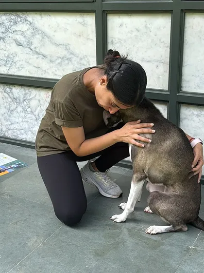 A comforting hug for Piku. Part of behavior modification is building a deep bond of trust and making the dog feel safe.