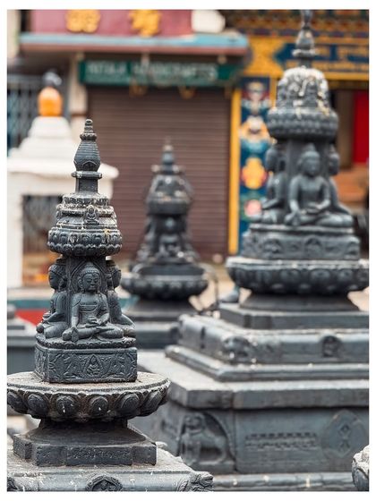 A close-up of miniature Buddhist stupas, showcasing the detailed craftsmanship of religious artifacts.