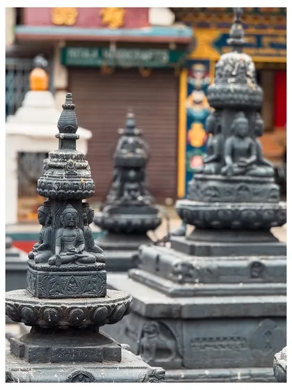 A close-up of miniature Buddhist stupas, showcasing the detailed craftsmanship of religious artifacts.