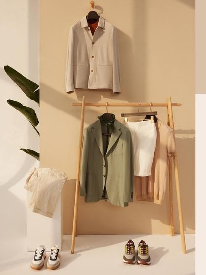 Step into a world of calm and comfort with our laid-back summer lineup. This flat lay of jackets and essentials encourages you to embrace the moment.