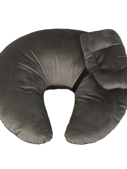 A grey nursing and feeding pillow for mothers, shot on a white background.