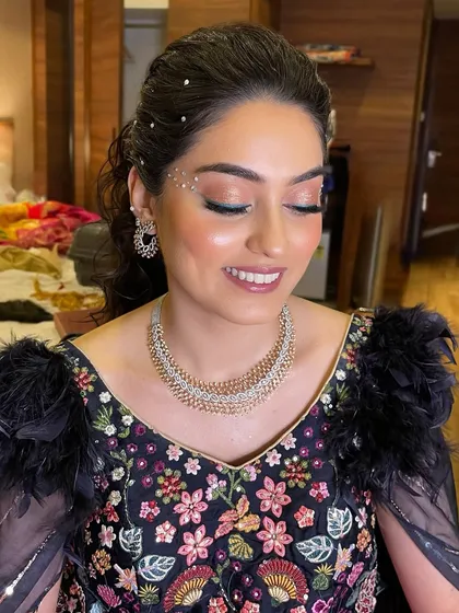 Another angle of this dreamy Sangeet look, showing the beautiful shimmer on the eyelids and the flawless, glowing skin.