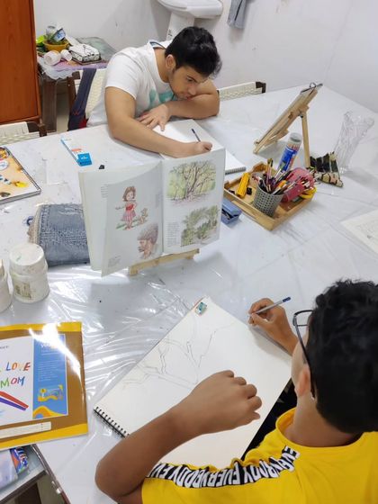 A teen student learns to draw and paint a complex tree structure, focusing on the fundamentals of form and color.