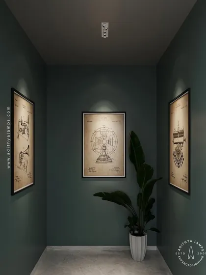 In this narrow gallery space, our architectural ceiling lights are precisely aimed to spotlight each piece of art. This creates individual focus on each frame while maintaining a moody, sophisticated atmosphere in the room.
