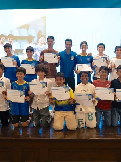 The U13 and U15 players from our Xcelerate program pose for a group photo on stage with their certificates. This is a moment to recognize the progress and dedication of our youth teams.