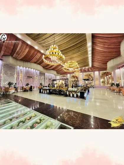 A stunning, grand ballroom event we catered, with our extensive buffet stations set up under magnificent chandeliers.