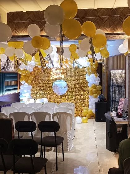 A full view of the venue for the 13th birthday party, showing how our decorations, including the main backdrop and ceiling balloons, transform the entire space.