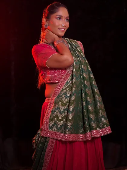A full-length shot of the model, her confidence shining through. This look is a celebration of color and culture.