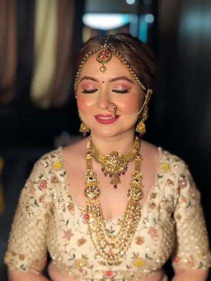 That serene bridal glow, captured just before she begins her new chapter. This close-up shows my signature 'filterless beauty' approach. I focused on creating luminous skin, soft pink eyeshadow, and perfectly defined features that look flawless both in person and on camera.